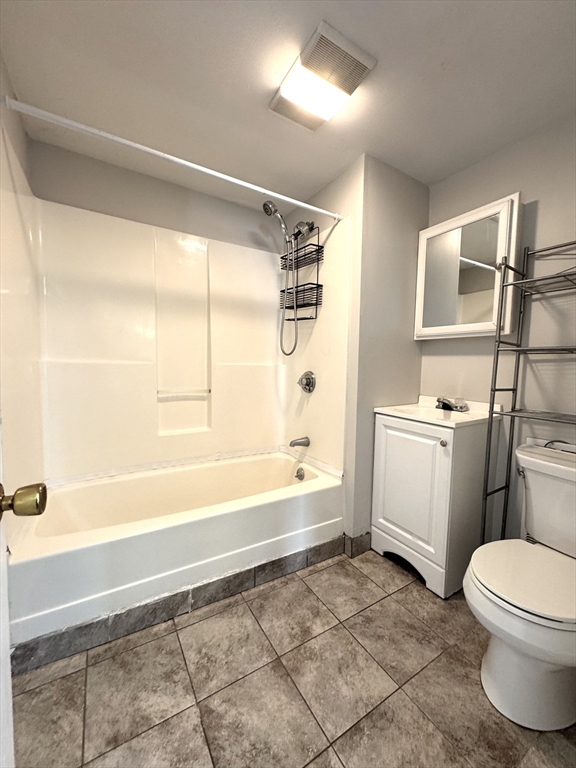 69 Cleveland Avenue, Unit 1 Everett, MA 02149 - Photo 8 of 13 a bathroom with a sink a toilet and a bathtub