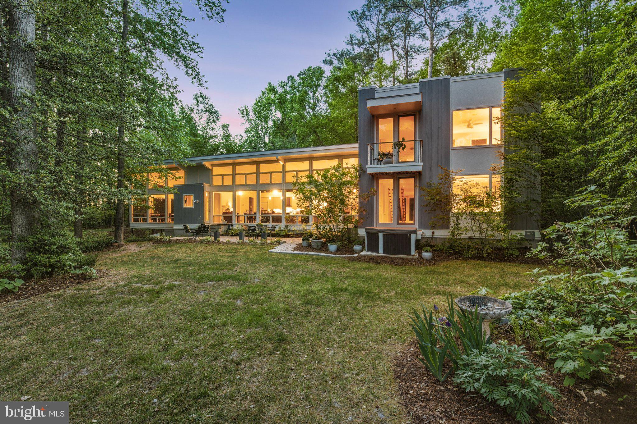Modern retreat nestled in lush greenery.