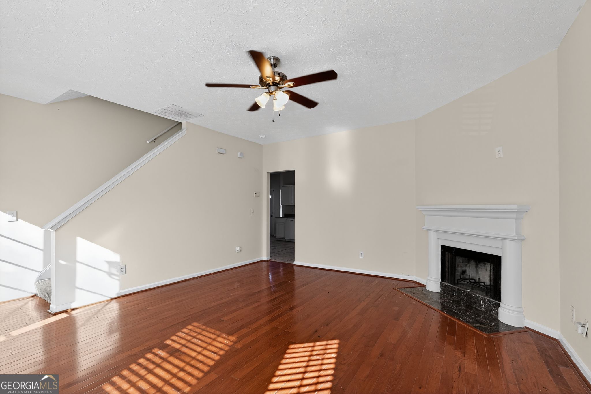 3812 Walnut Path Lithonia, GA 30038 - Photo 12 of 37 a view of empty room with wooden floor and fan