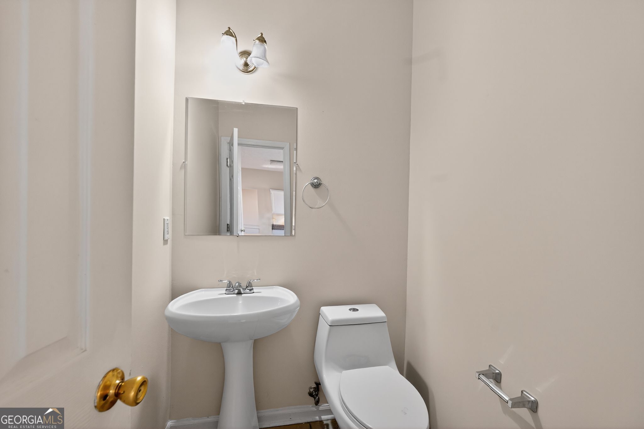 3812 Walnut Path Lithonia, GA 30038 - Photo 21 of 37 a bathroom with a toilet sink and mirror