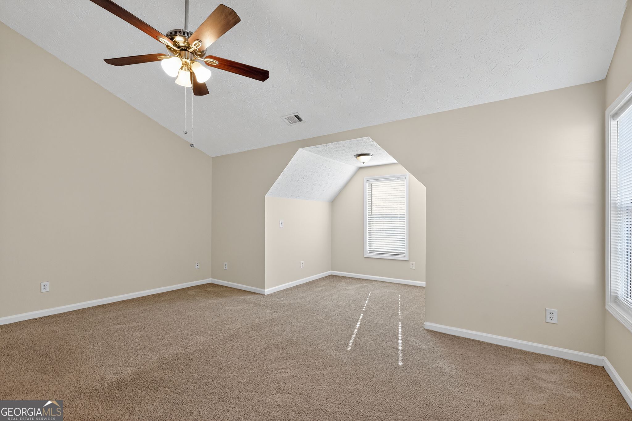 3812 Walnut Path Lithonia, GA 30038 - Photo 26 of 37 an empty room with windows and fan