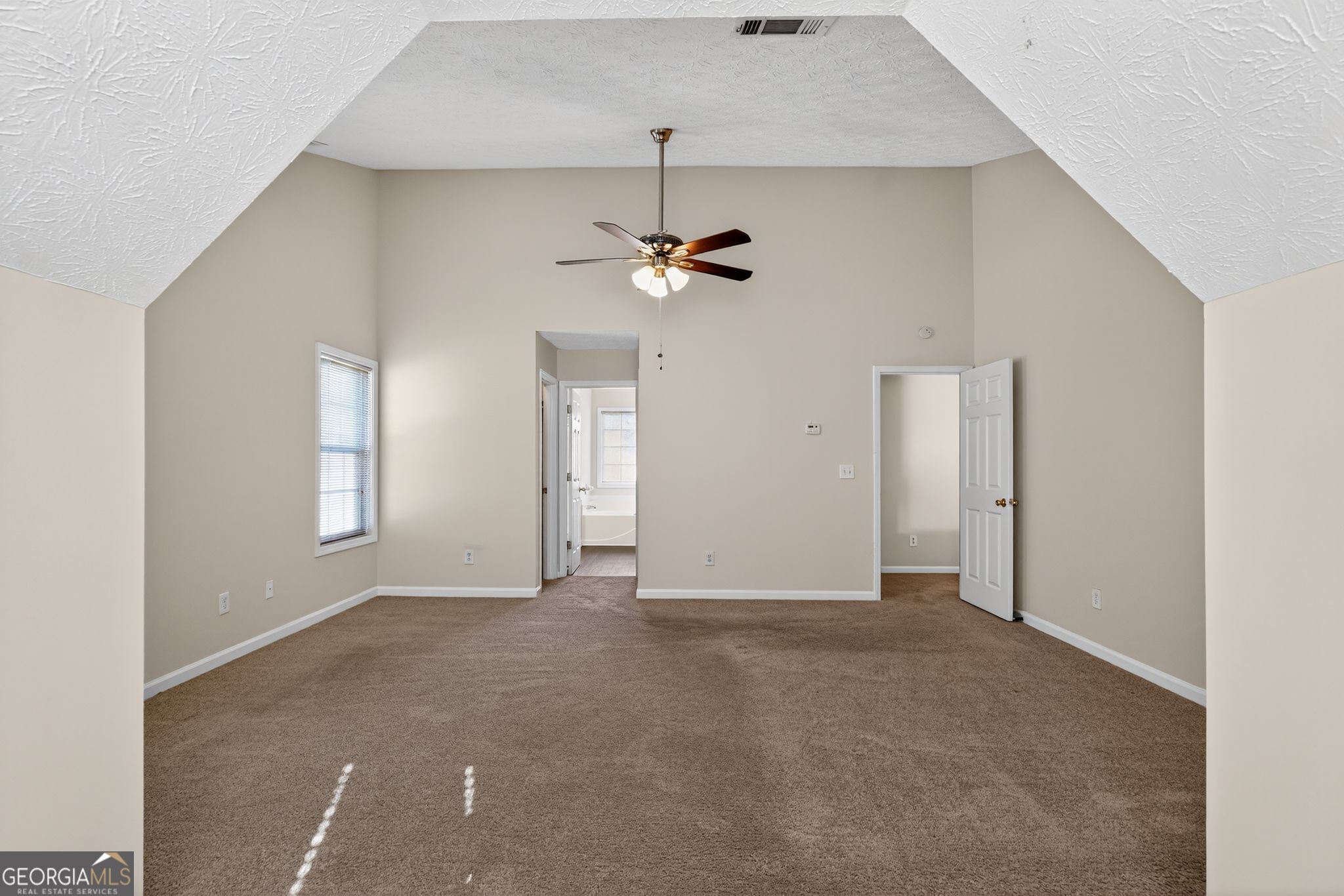 3812 Walnut Path Lithonia, GA 30038 - Photo 28 of 37 an empty room with windows and fan