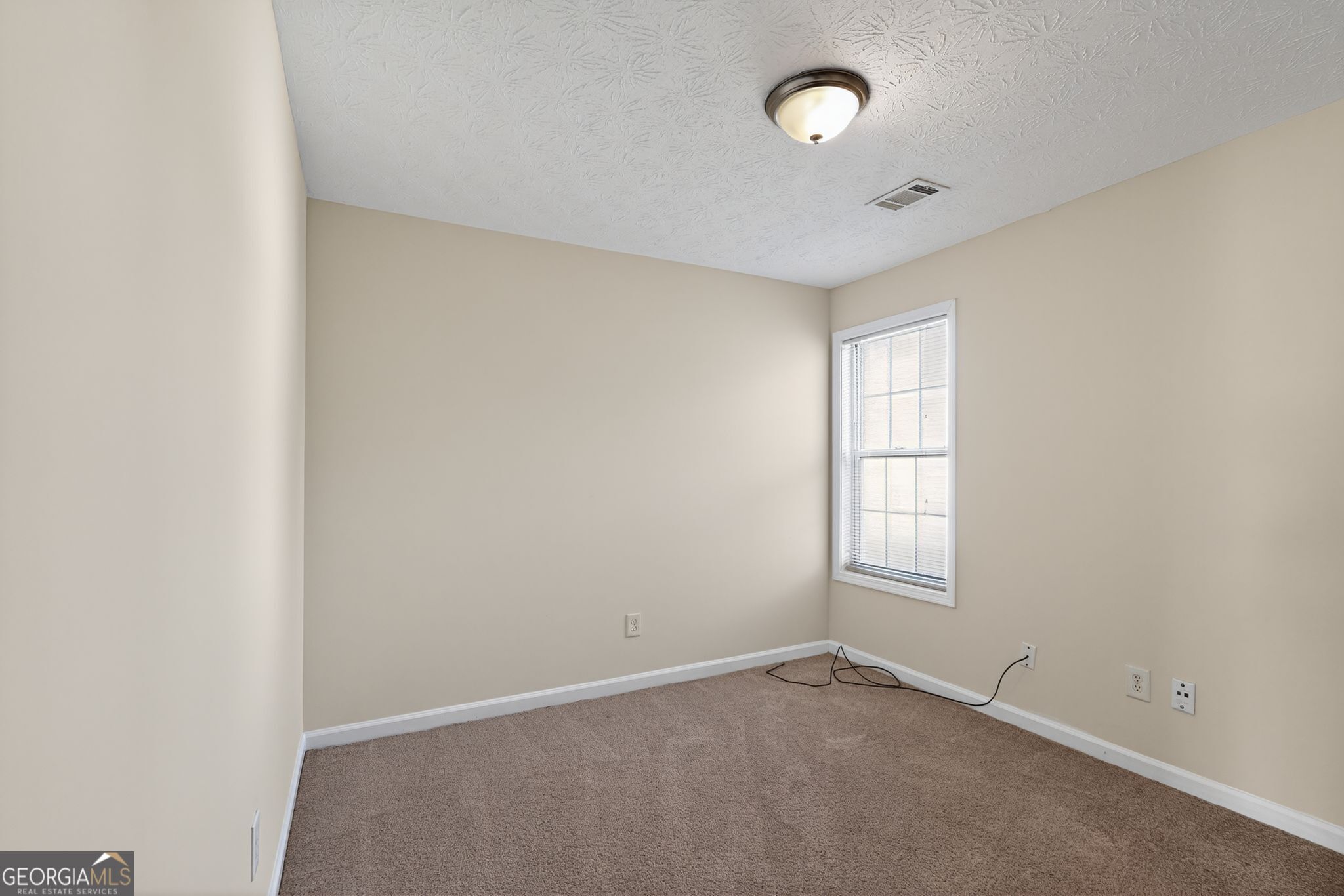 3812 Walnut Path Lithonia, GA 30038 - Photo 31 of 37 an empty room with windows and closet
