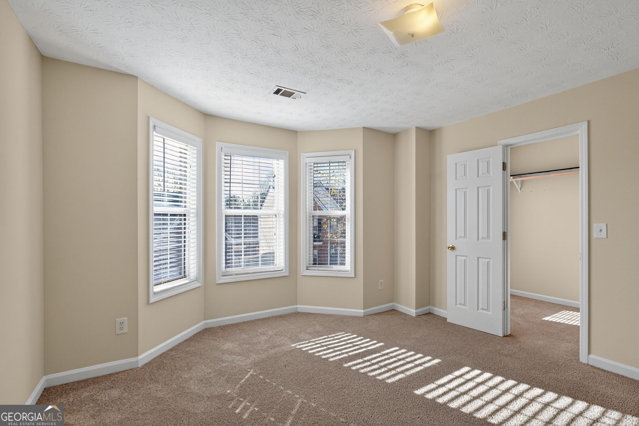 3812 Walnut Path Lithonia, GA 30038 - Photo 37 of 37 a view of an empty room with a window and wooden floor