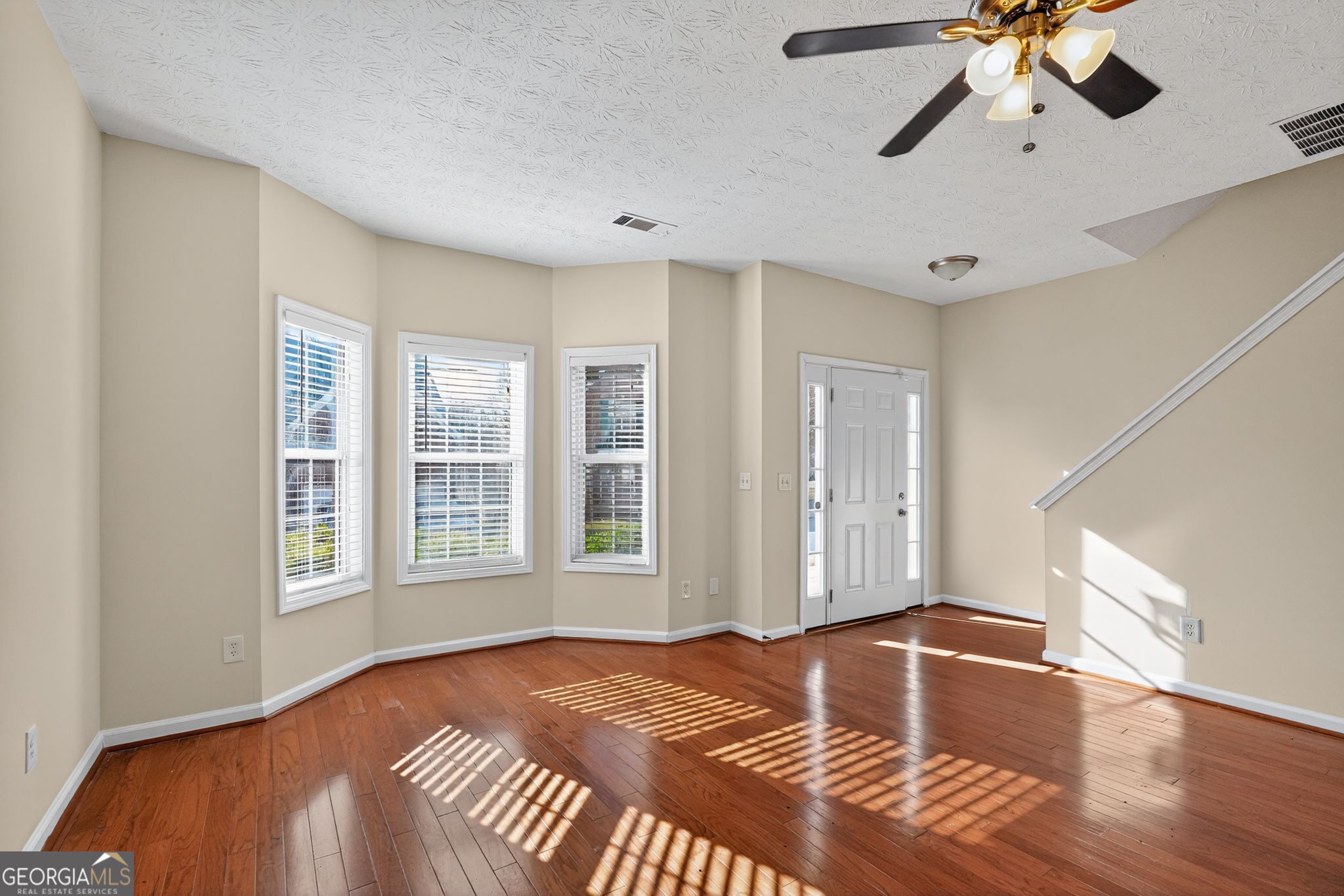 3812 Walnut Path Lithonia, GA 30038 - Photo 10 of 37 a view of a livingroom with a ceiling fan and window