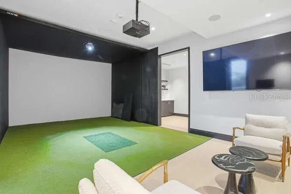 a view of a swimming pool with a lounge chairs