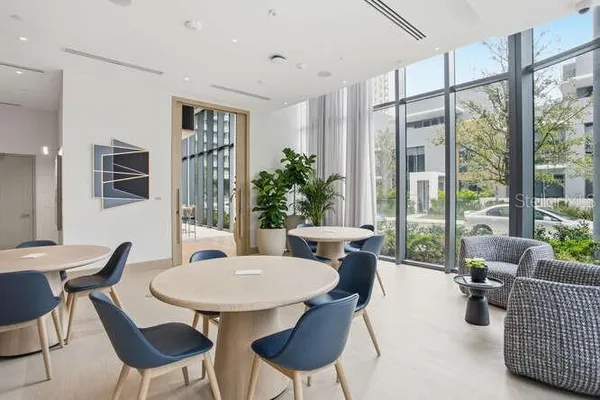 a view of a dining room with furniture window and outside view