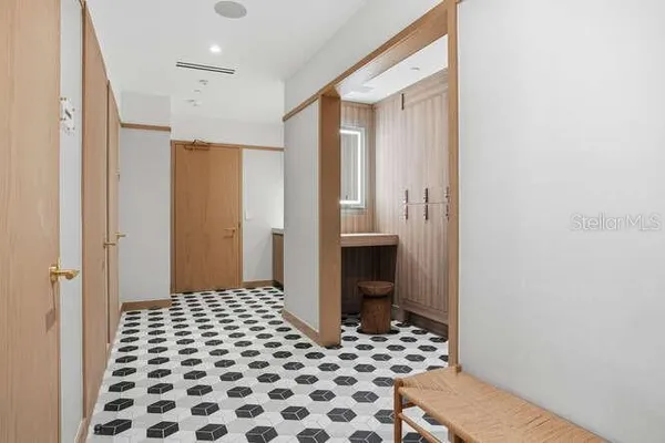 a bathroom with a glass door shower
