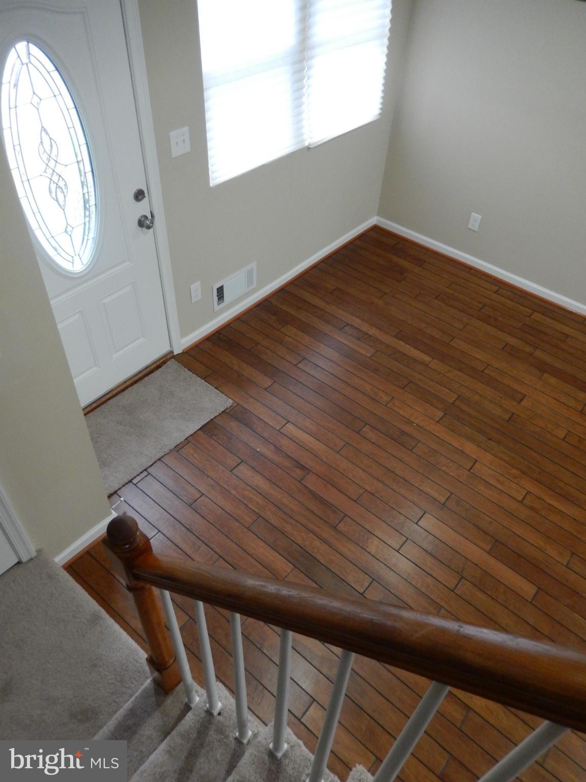925 Coleridge Road Baltimore, MD 21229 - Photo 4 of 30 a view of wooden floor in an empty room