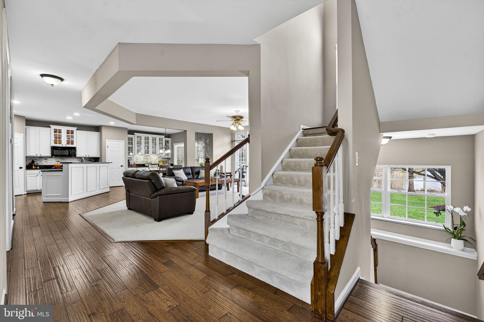 6913 Bitterroot Court Gainesville, VA 20155 - Photo 17 of 56 Staircase with view of pond as you descend