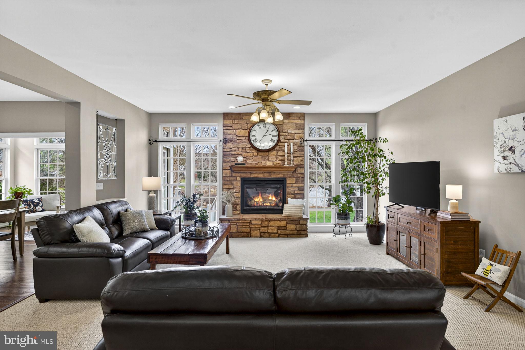 6913 Bitterroot Court Gainesville, VA 20155 - Photo 18 of 56 Family room, impressive stacked stone fire place