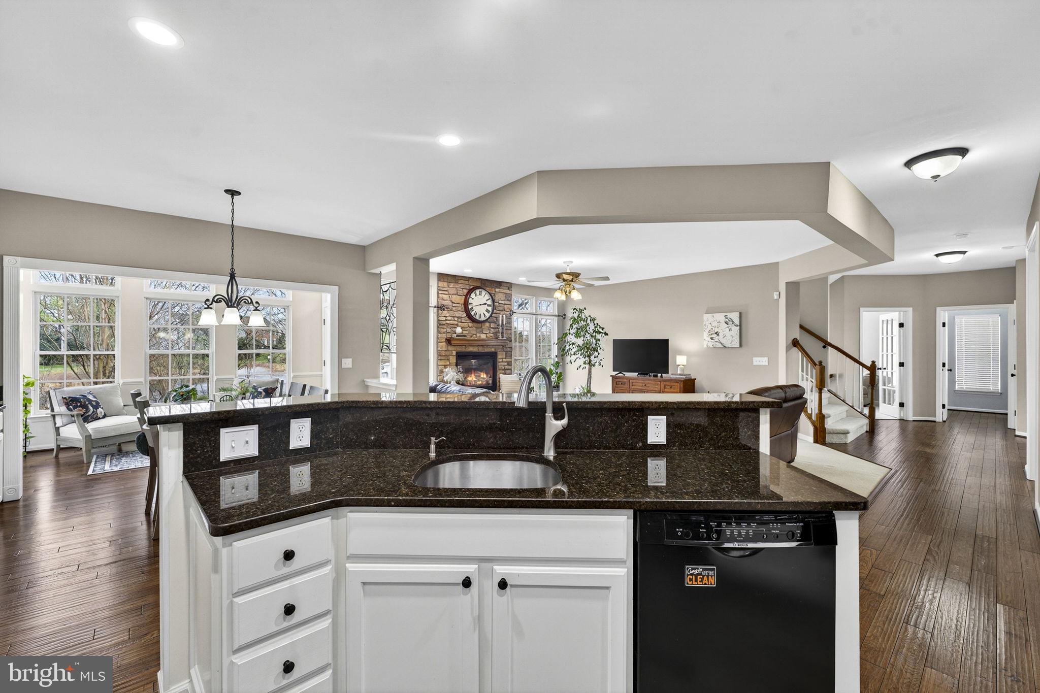 6913 Bitterroot Court Gainesville, VA 20155 - Photo 21 of 56 Island w/sink opens to family room and sunroom