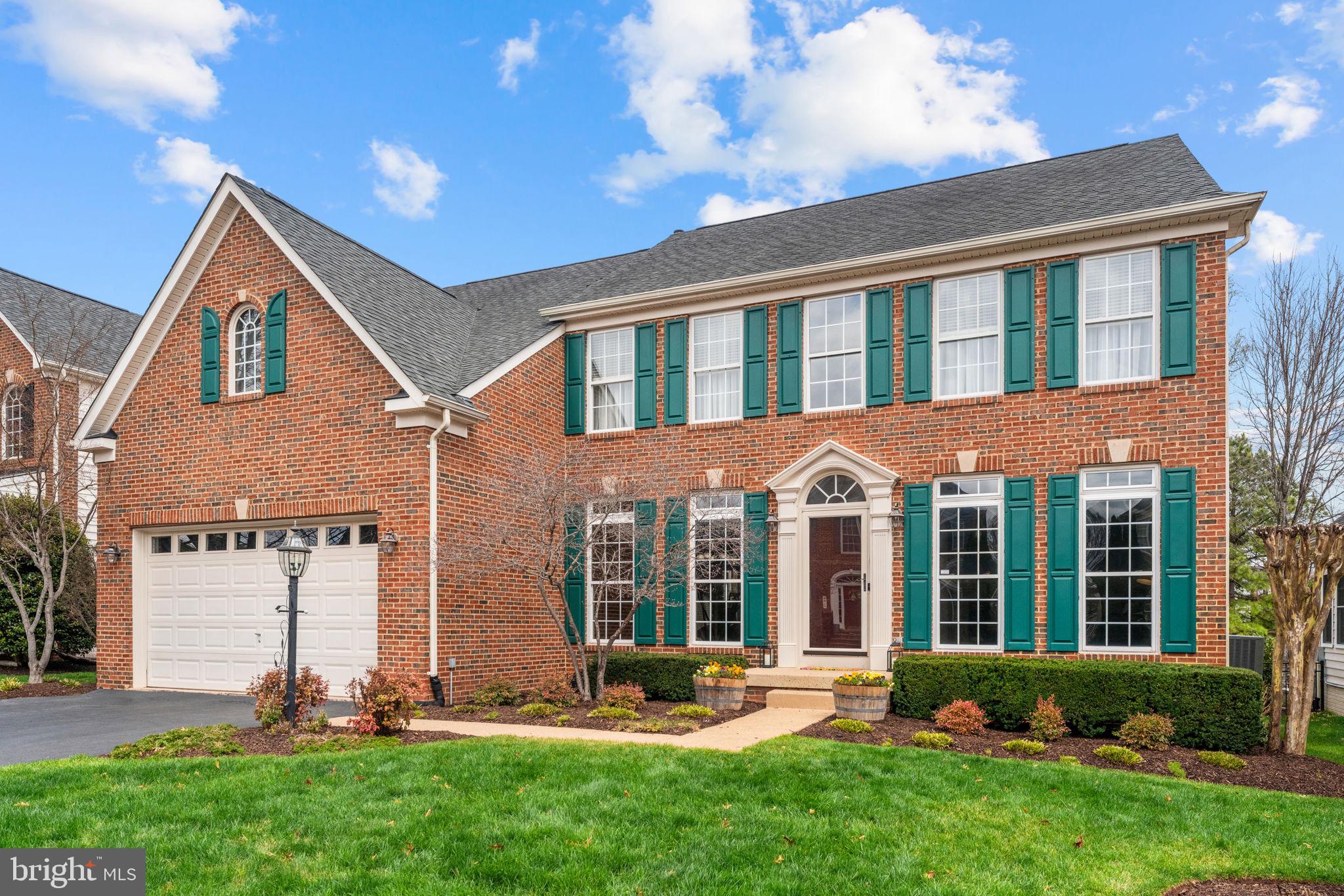 6913 Bitterroot Court Gainesville, VA 20155 - Photo 3 of 56 Brick front, storm door