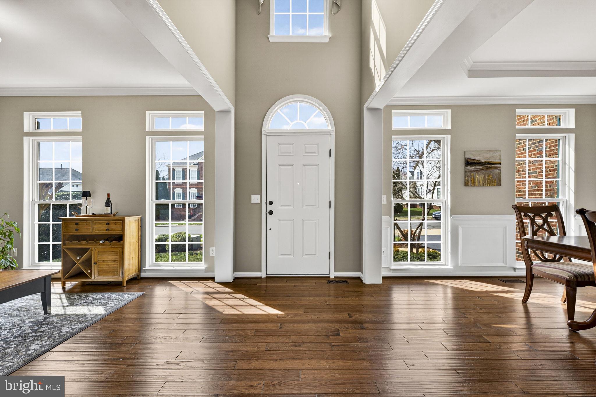 6913 Bitterroot Court Gainesville, VA 20155 - Photo 10 of 56 Two story foyer, check out the gorgeous hardwoods