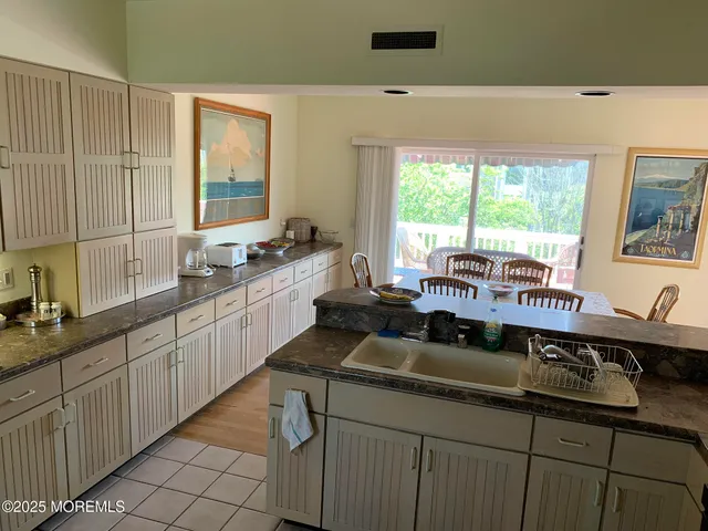 a view of living room with furniture and book shelf