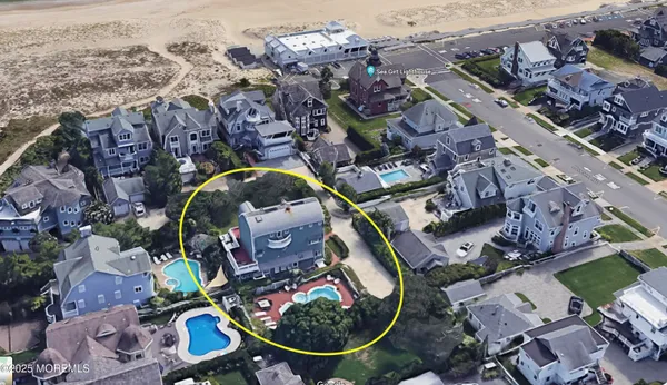 an aerial view of residential house with outdoor space and parking