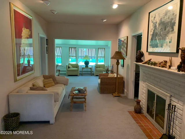 a workspace with furniture wooden floor and a window