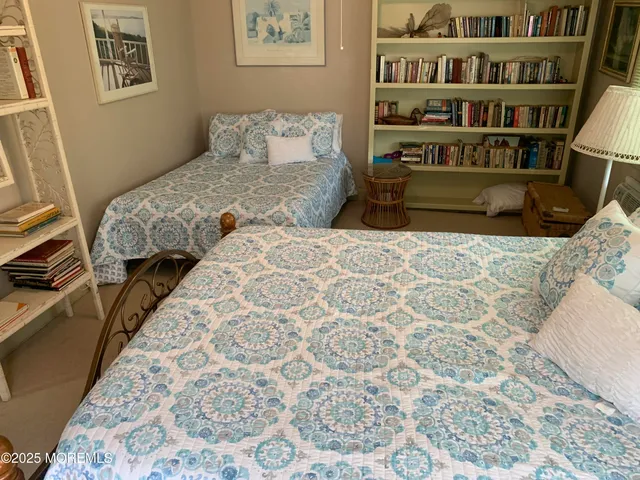 a kitchen with kitchen island granite countertop a stove a sink and a refrigerator