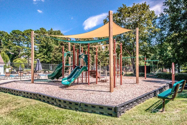 a view of a yard with a tree