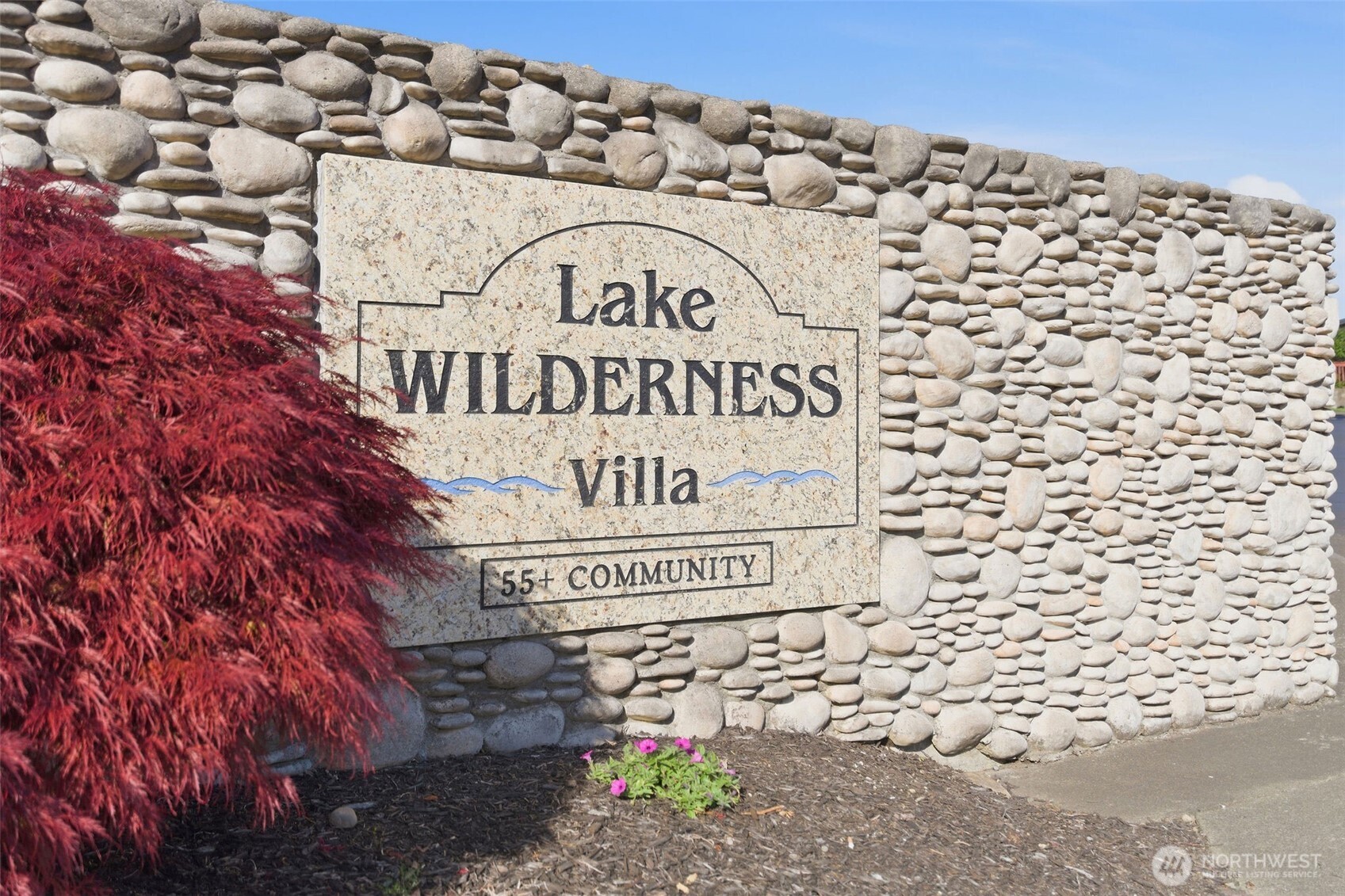 24036 222nd Avenue Southeast Maple Valley, WA 98038 - Photo 31 of 37 a sign on the side of a building