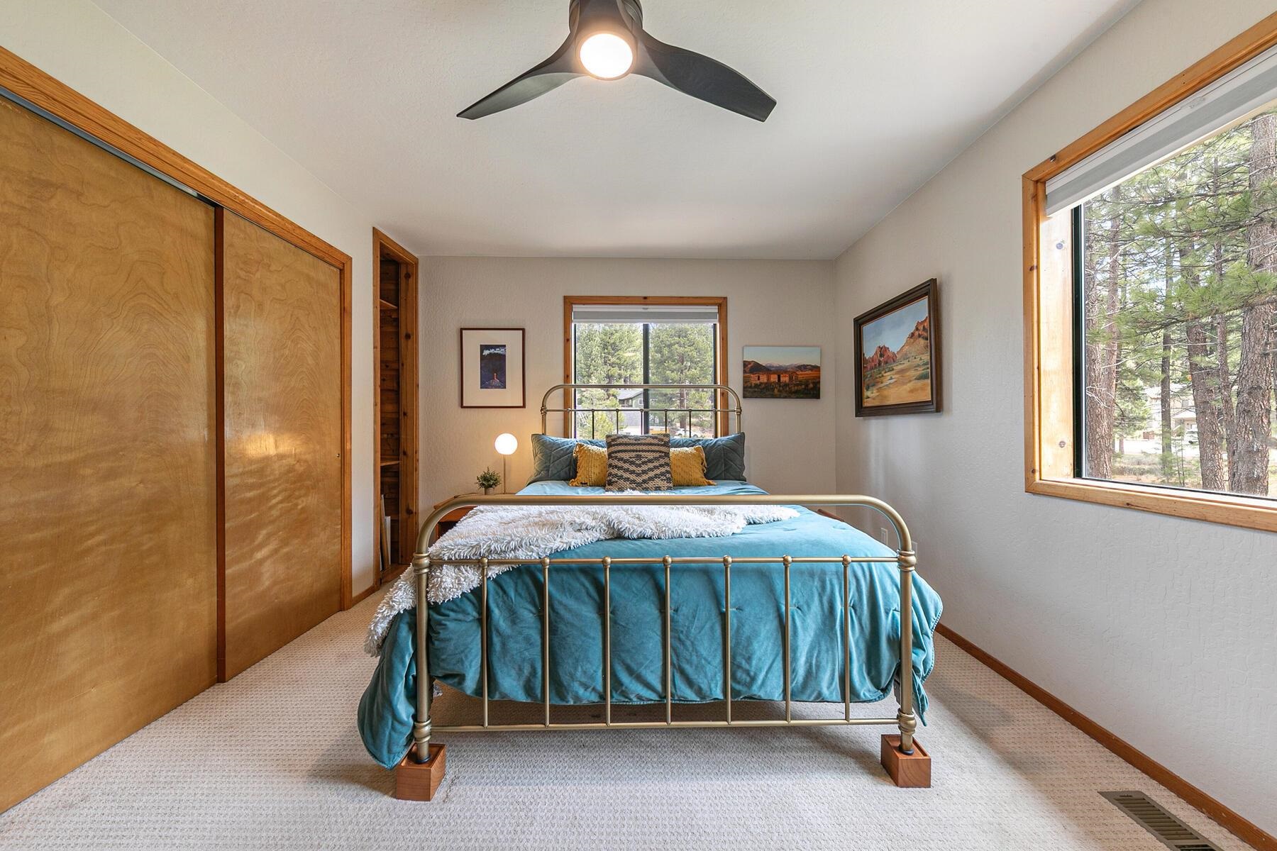 10455 Regency Circle Truckee, CA 96161 - Photo 12 of 28 a bed sitting in a spacious bedroom next to a window