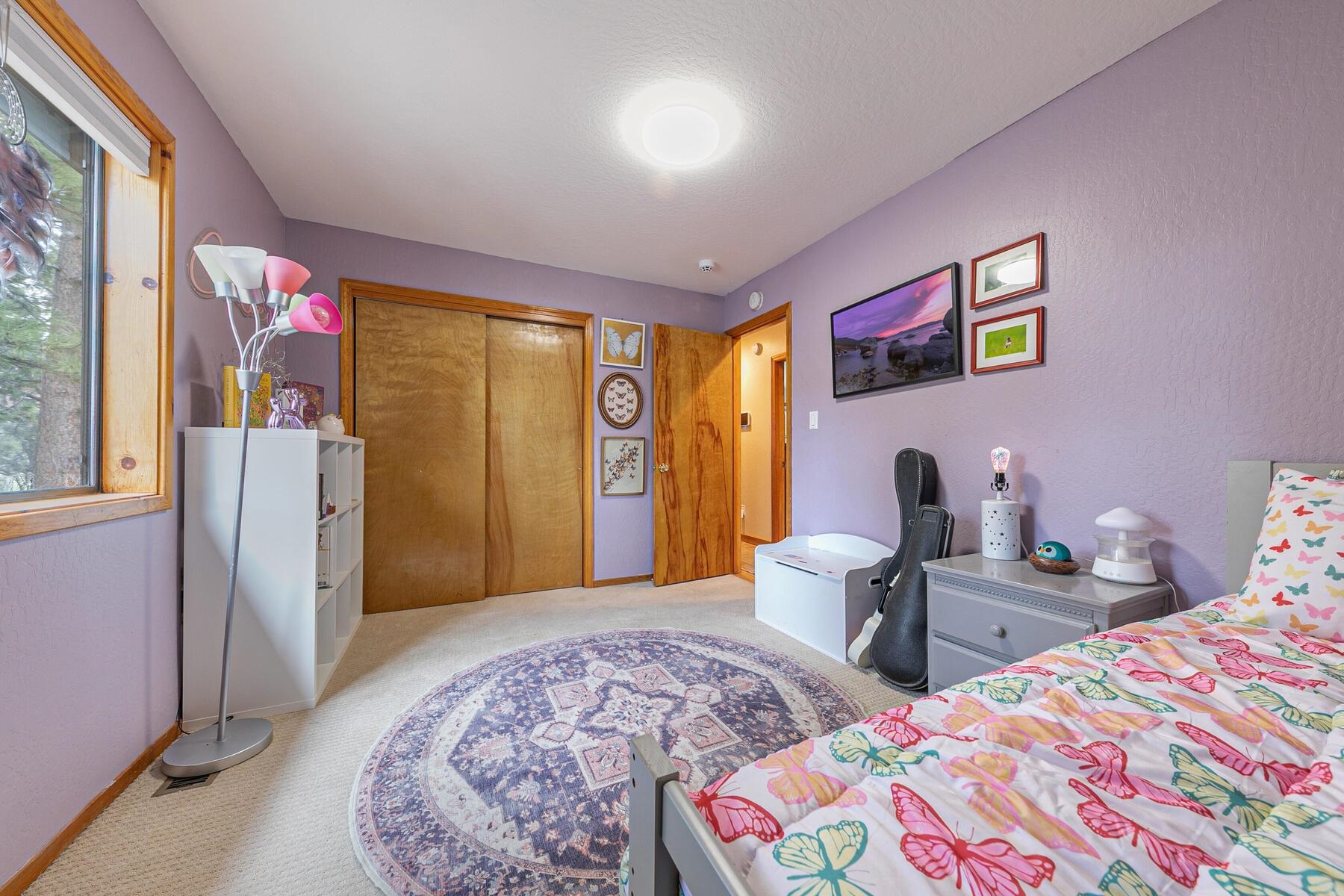 10455 Regency Circle Truckee, CA 96161 - Photo 16 of 28 a bedroom with bed and wooden floor