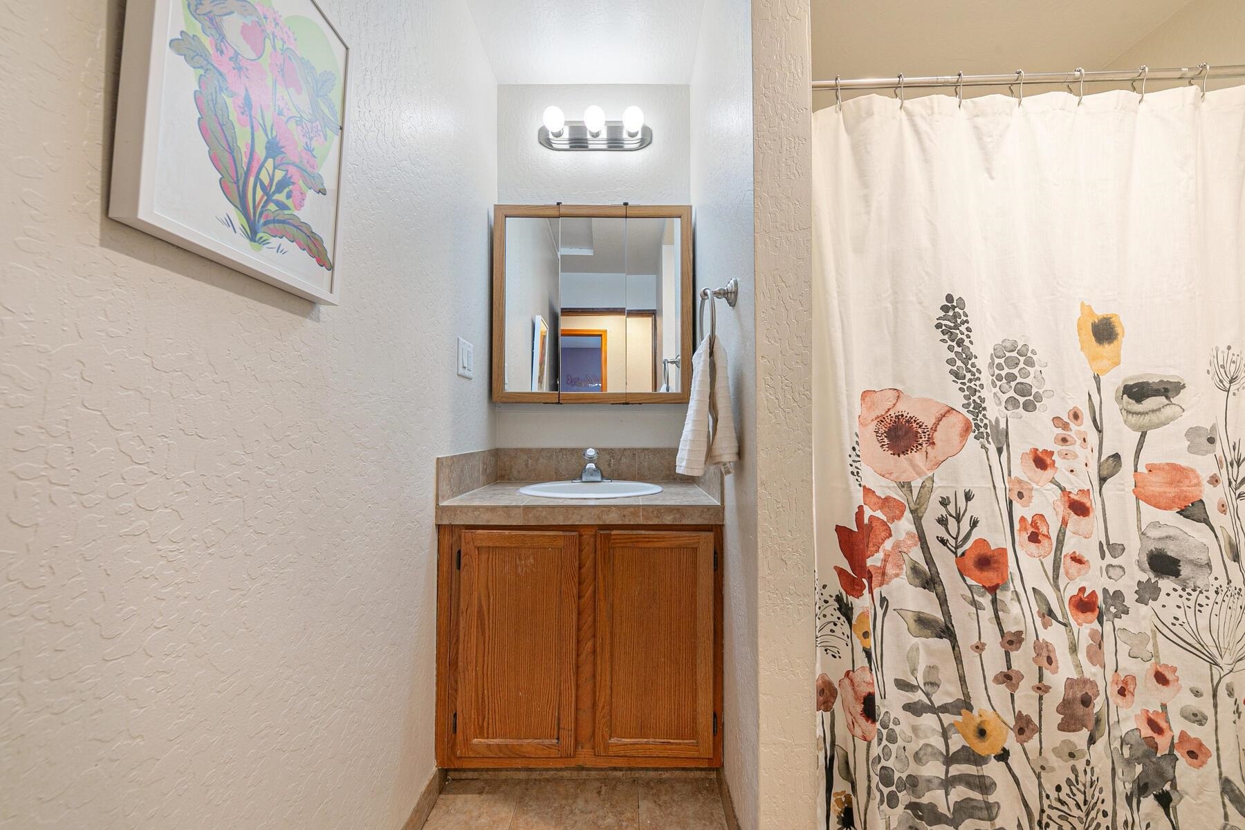 10455 Regency Circle Truckee, CA 96161 - Photo 17 of 28 a view of a bathroom with a sink and a mirror