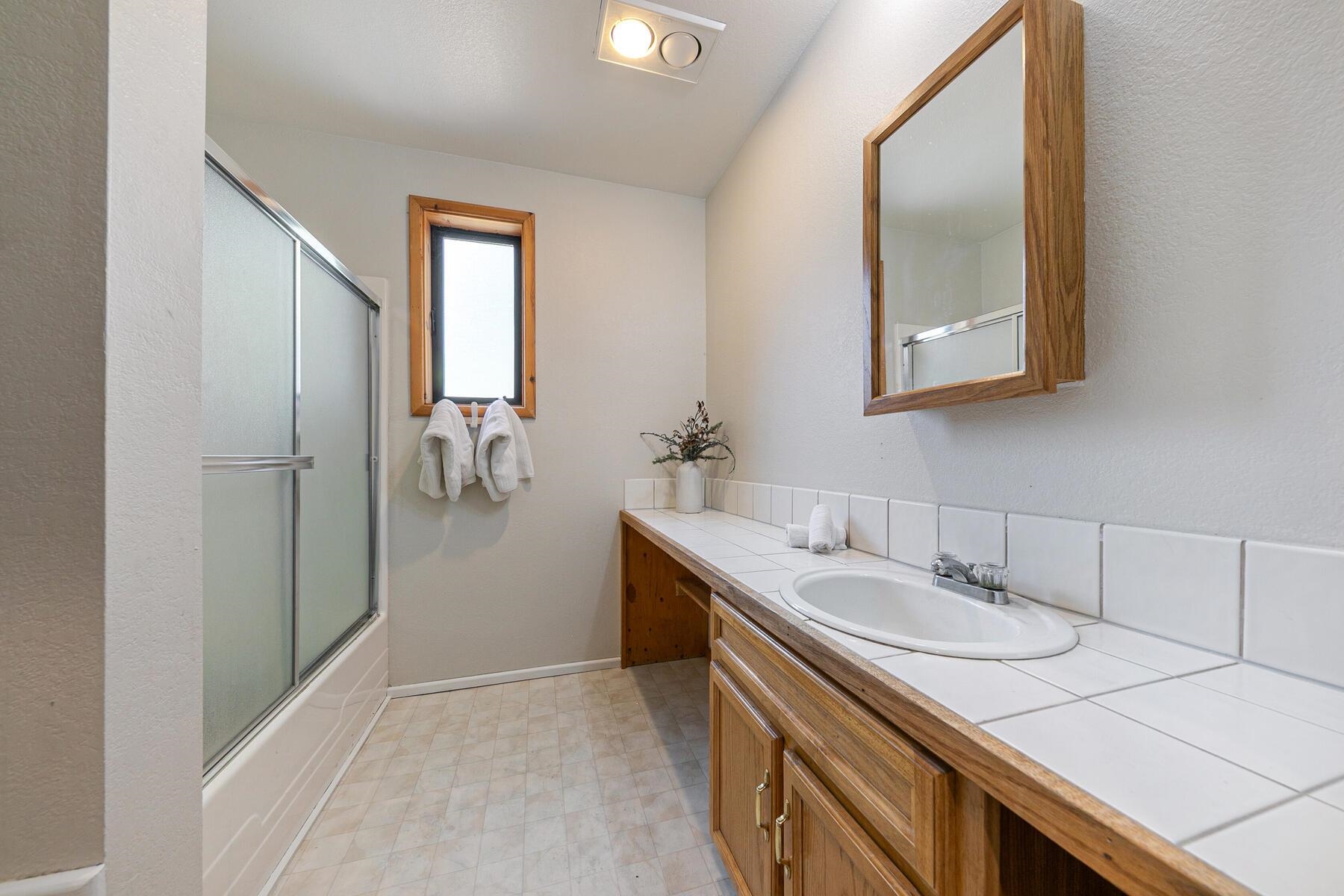 10455 Regency Circle Truckee, CA 96161 - Photo 22 of 28 a bathroom with a sink and a mirror