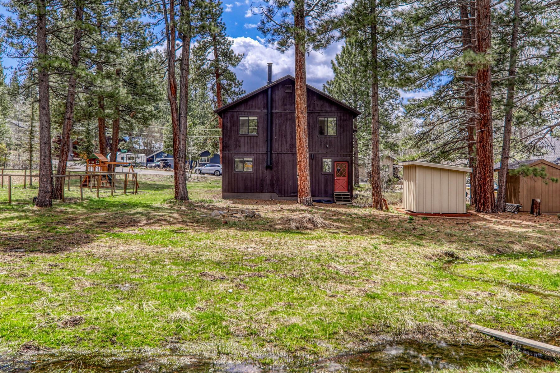 10455 Regency Circle Truckee, CA 96161 - Photo 26 of 28 a view of a house with a yard and tree s