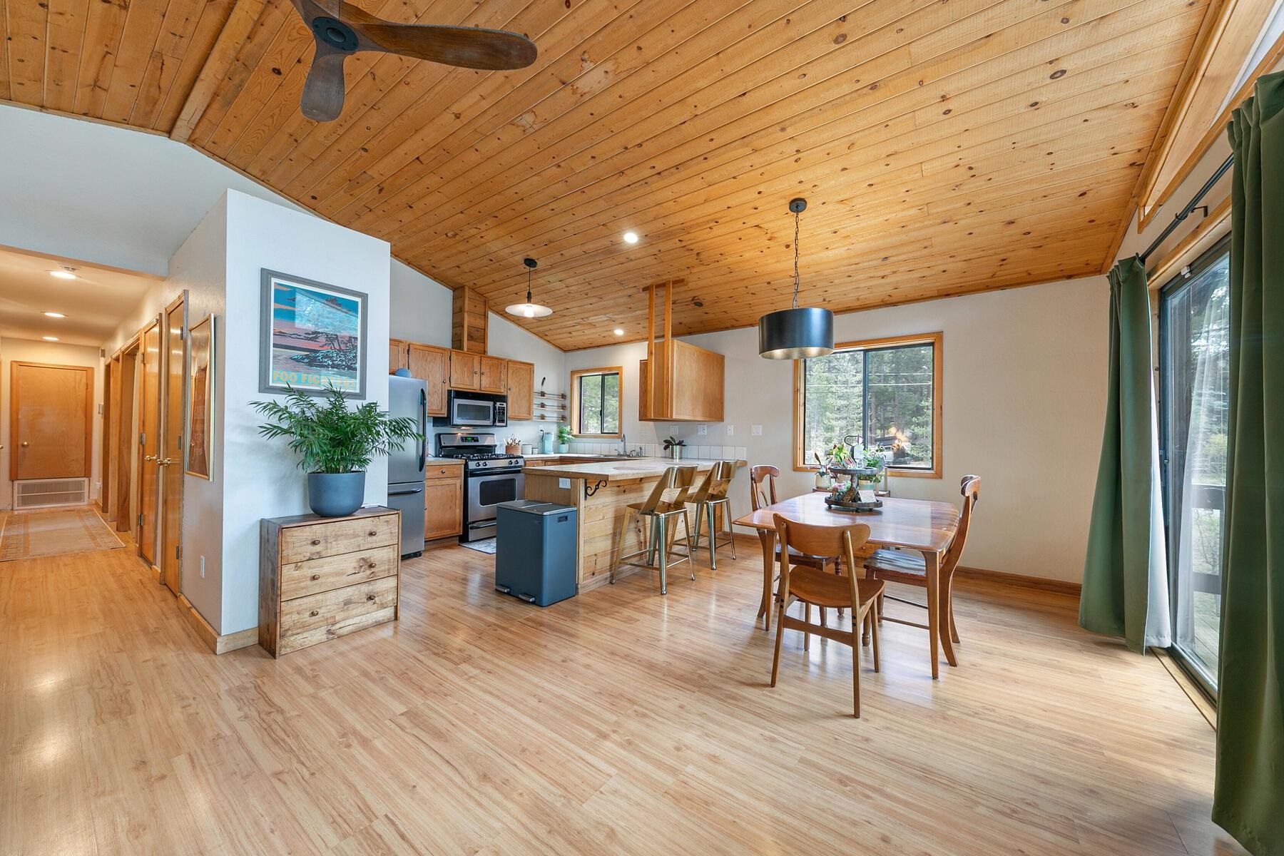 10455 Regency Circle Truckee, CA 96161 - Photo 7 of 28 a view of a dining room with furniture window and wooden floor
