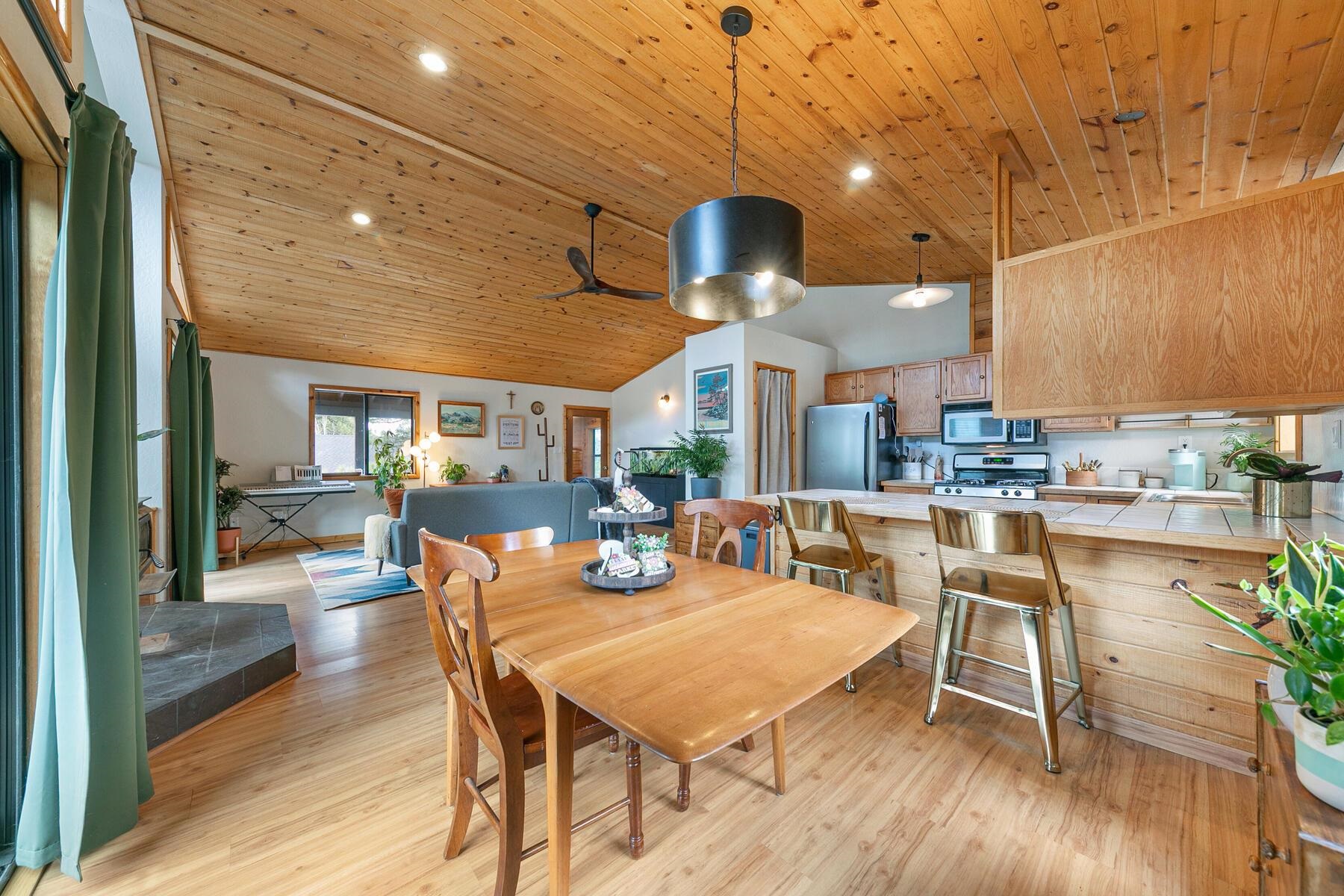 10455 Regency Circle Truckee, CA 96161 - Photo 8 of 28 a dining room with wooden floor a glass table and chairs