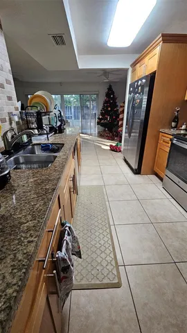 a stove top oven sitting inside of a kitchen