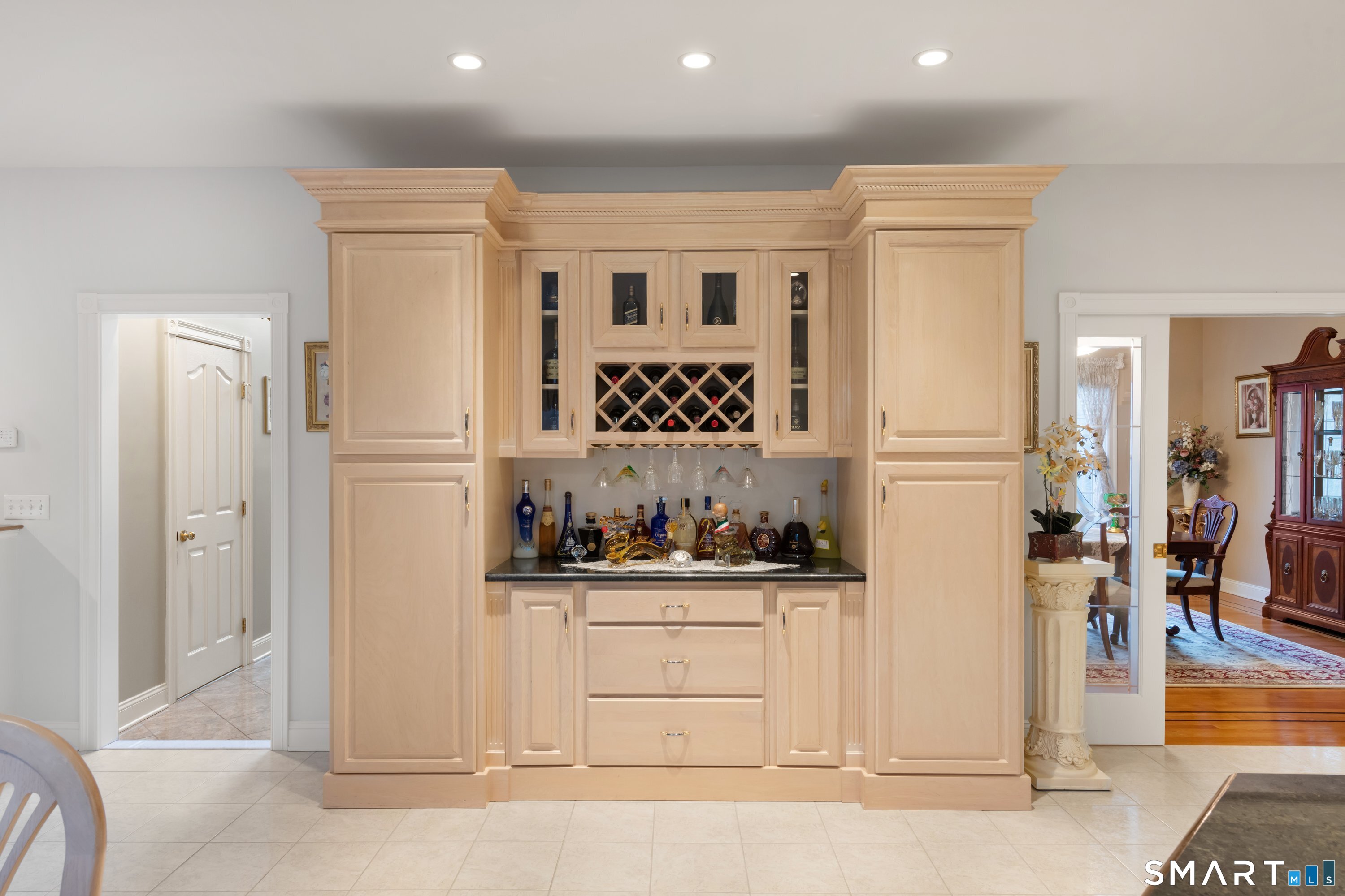 420 Summer Hill Road Madison, CT 06443 - Photo 20 of 40 a kitchen with white cabinets and black appliances
