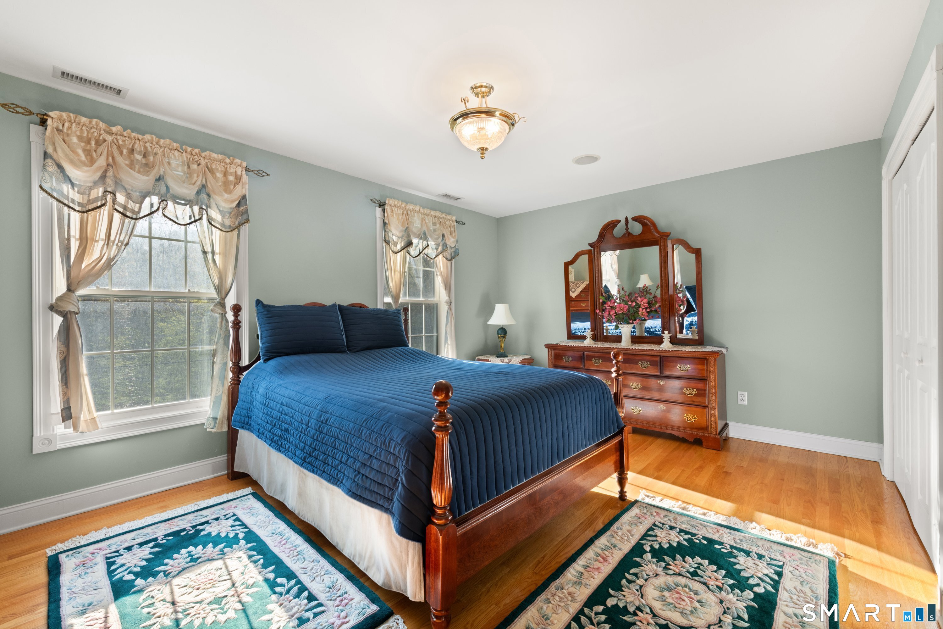 420 Summer Hill Road Madison, CT 06443 - Photo 29 of 40 a bedroom with a bed and a window