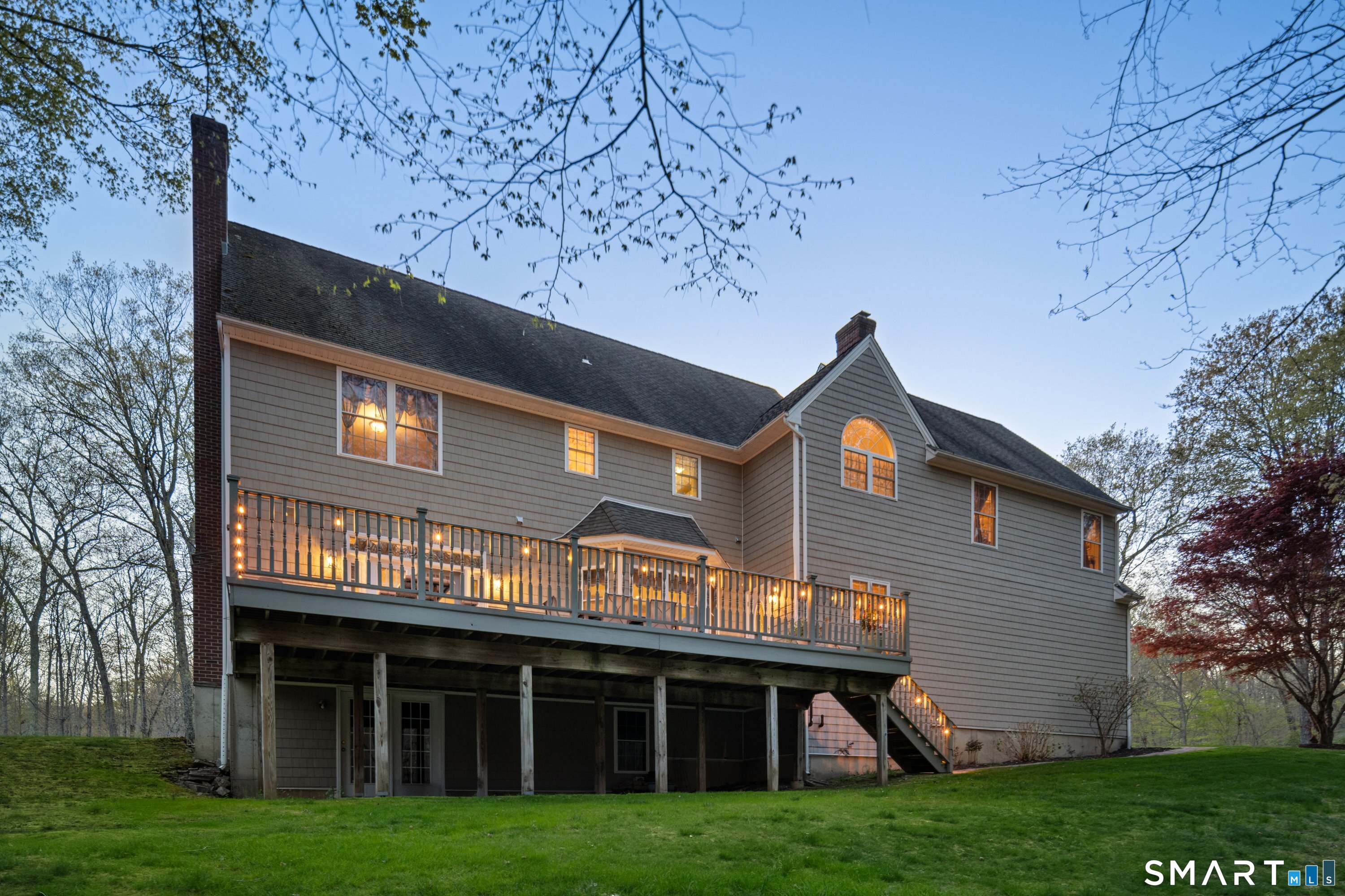 420 Summer Hill Road Madison, CT 06443 - Photo 3 of 40 a front view of a house with a garden