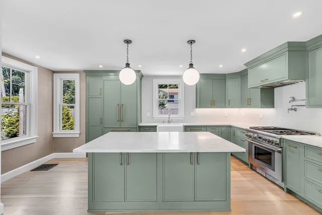 a kitchen with a stove and a kitchen island