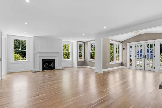 a living room with a fireplace and a window