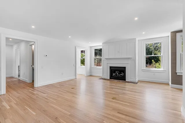 a view of an entryway with wooden floor and windows