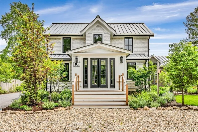 a view of a house with a yard and plants