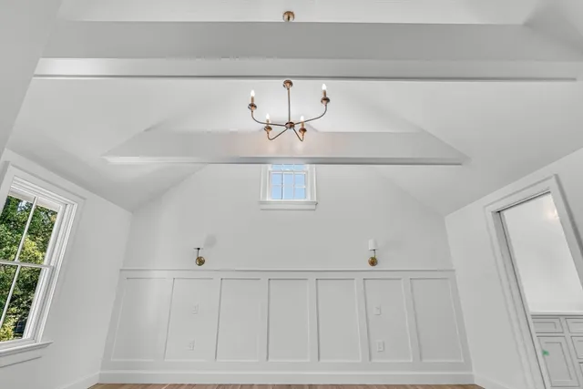 a spacious bathroom with double vanity and a window