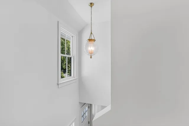 a view of an entryway with wooden floor