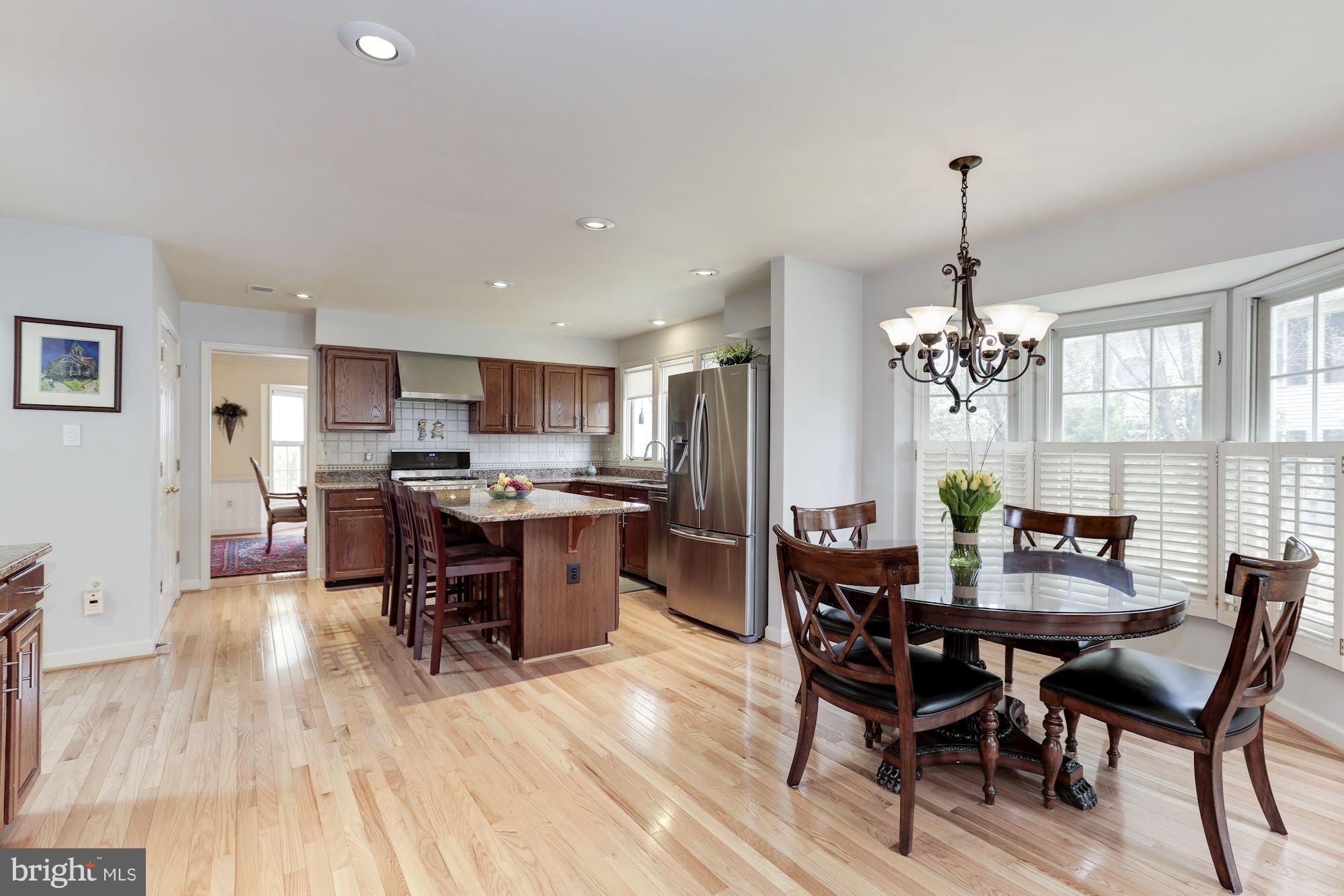 6402 Springhouse Circle Clifton, VA 20124 - Photo 12 of 30 a view of a dining room with furniture window and wooden floor