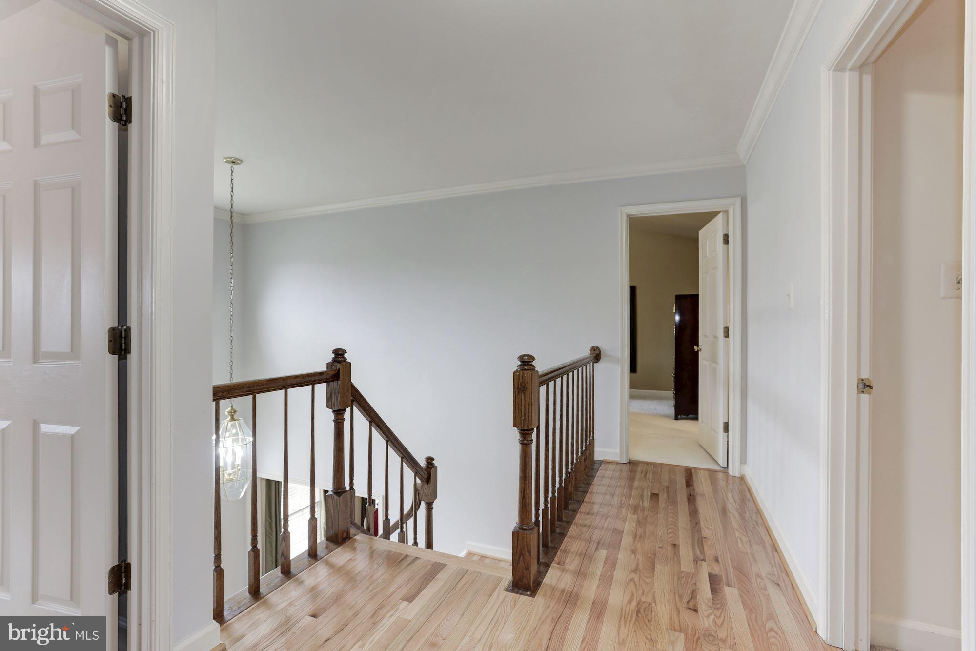 6402 Springhouse Circle Clifton, VA 20124 - Photo 21 of 30 a view of a hallway with wooden floor and entryway