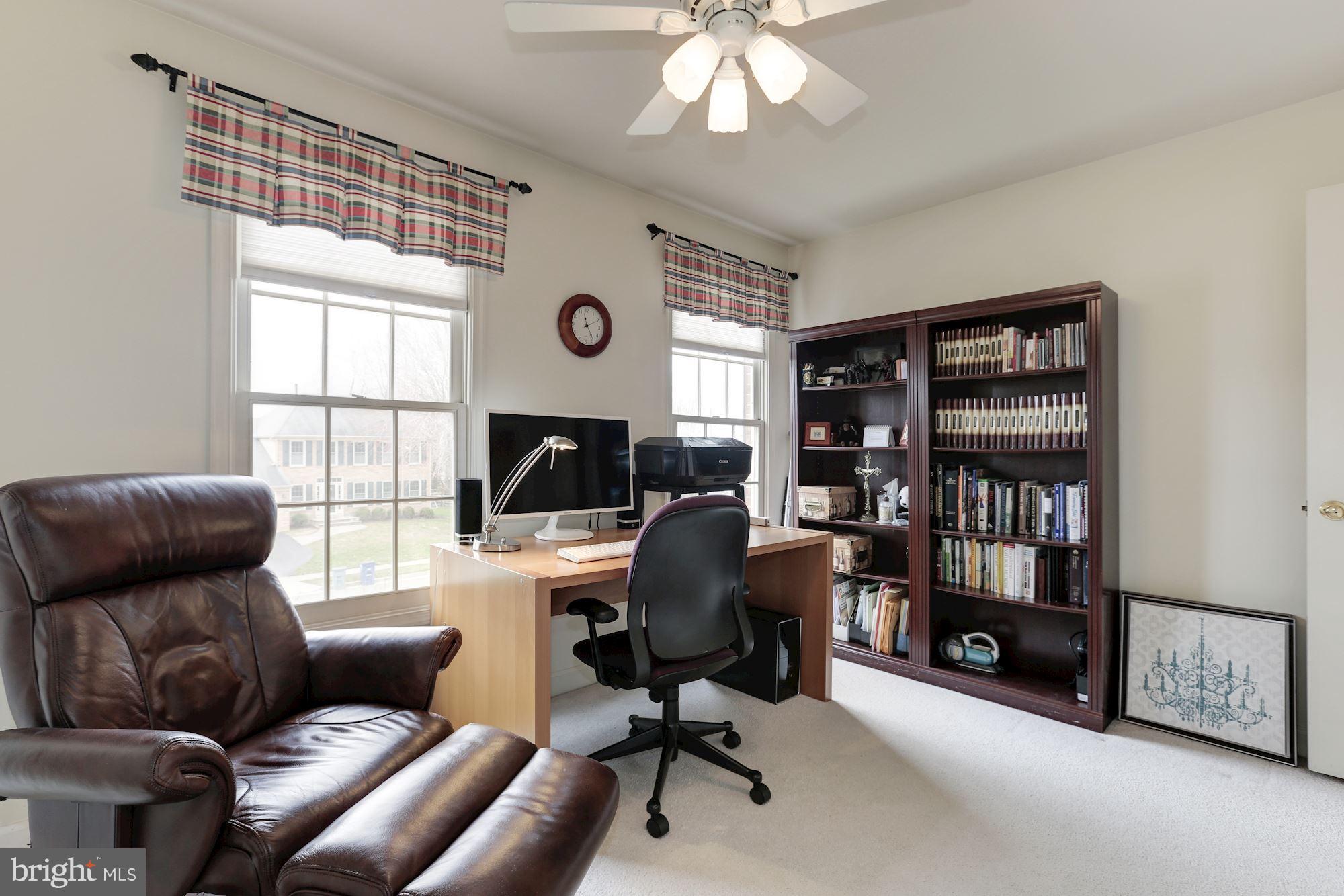 6402 Springhouse Circle Clifton, VA 20124 - Photo 24 of 30 a view of a livingroom with workspace and a window