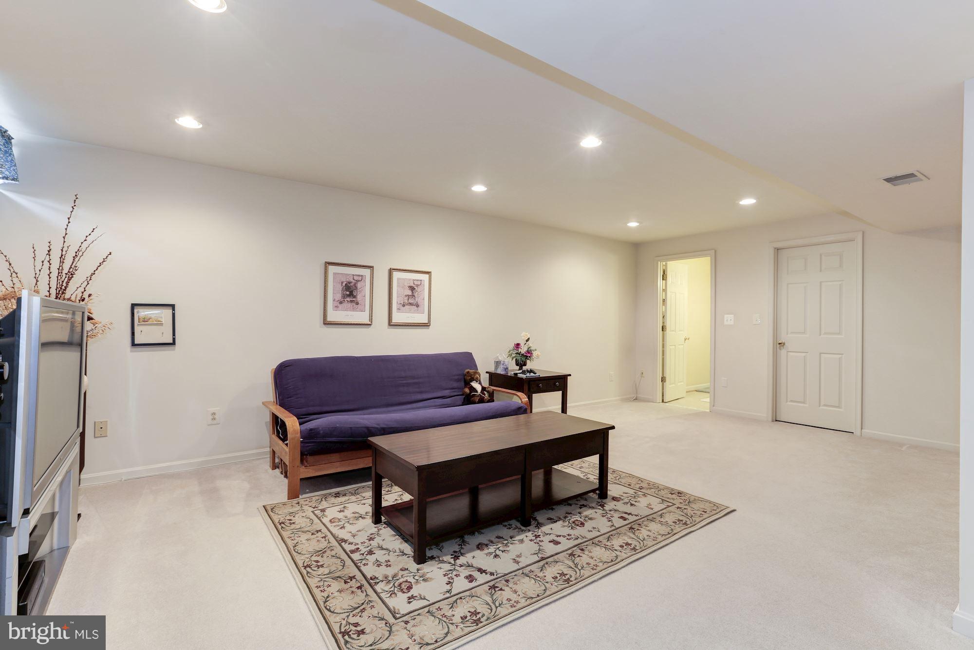 6402 Springhouse Circle Clifton, VA 20124 - Photo 28 of 30 a living room with furniture and a rug