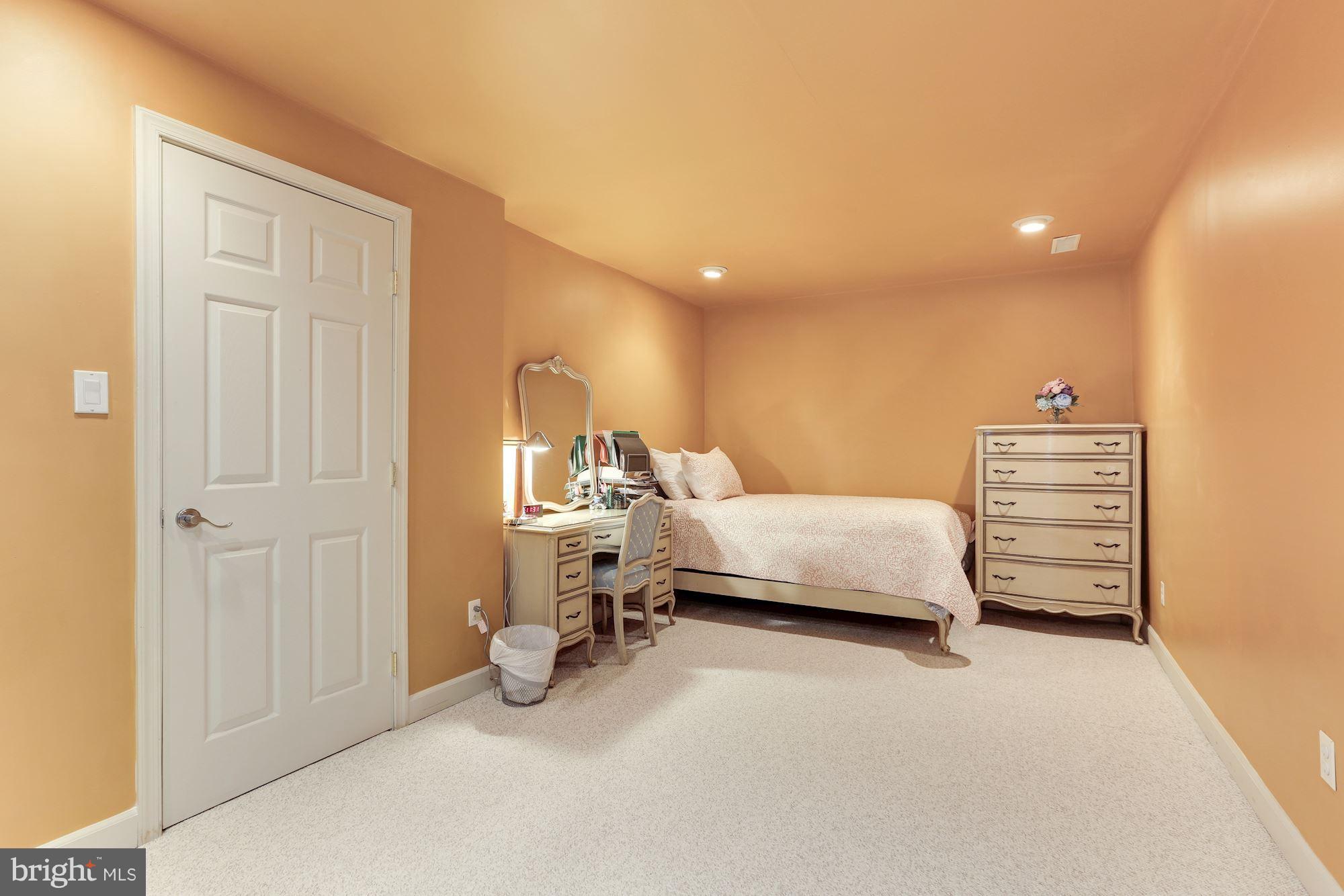 6402 Springhouse Circle Clifton, VA 20124 - Photo 29 of 30 a bedroom with furniture and a lamp