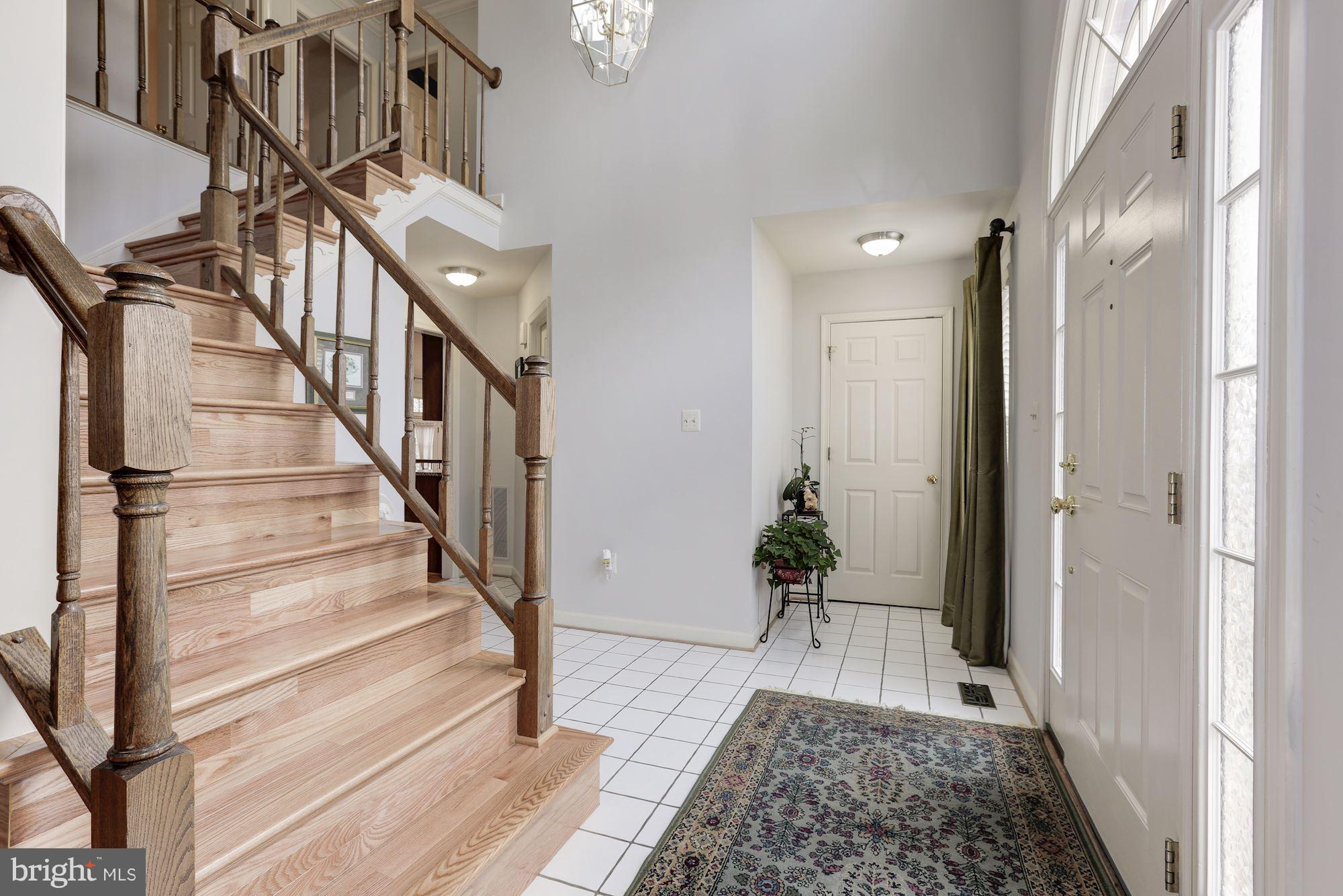 6402 Springhouse Circle Clifton, VA 20124 - Photo 4 of 30 a view of entryway and hall with wooden floor