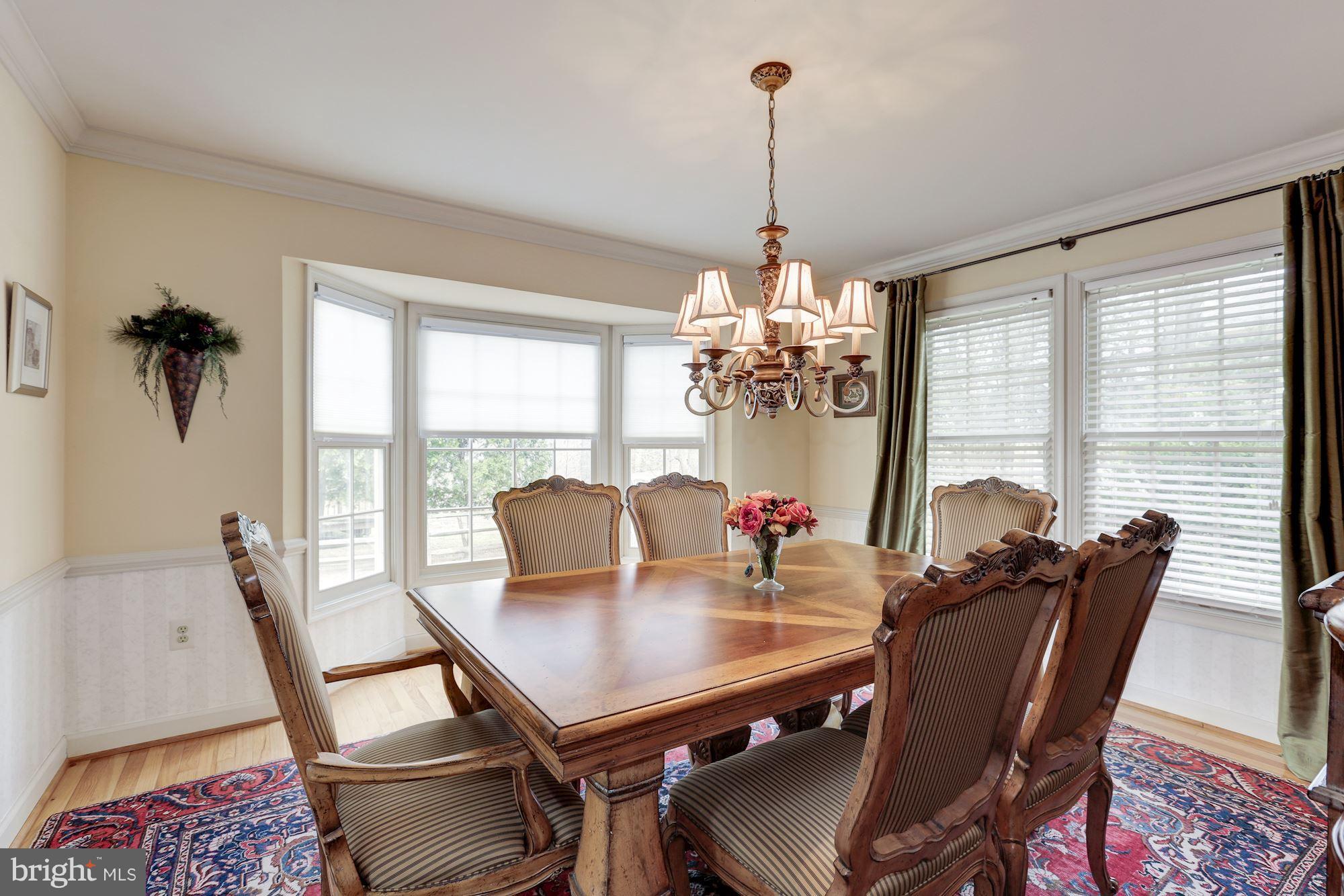6402 Springhouse Circle Clifton, VA 20124 - Photo 9 of 30 a view of a dining room with furniture window and outside view