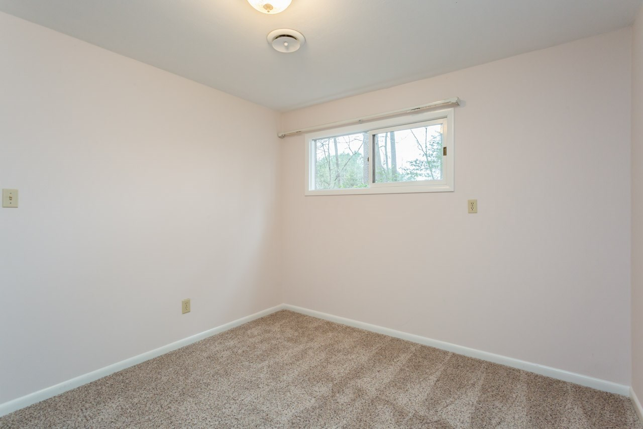6701 Laurdane Road Raleigh, NC 27613 - Photo 20 of 24 Brand new carpet in both downstairs rooms. Bedroom