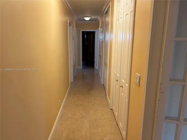 a view of a hallway with a wooden floor